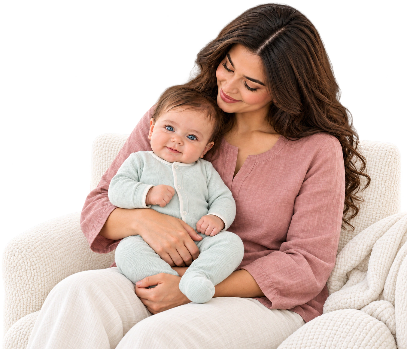 Mother holding her baby on a textured ivory sofa