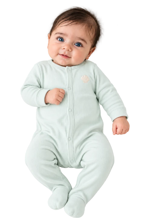 Newborn baby in a mint sleeper