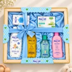 Nexton baby gift set with wooden basket containing newborn skincare and hygiene essentials