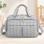 Large capacity baby diaper bag with multiple compartments and shoulder strap